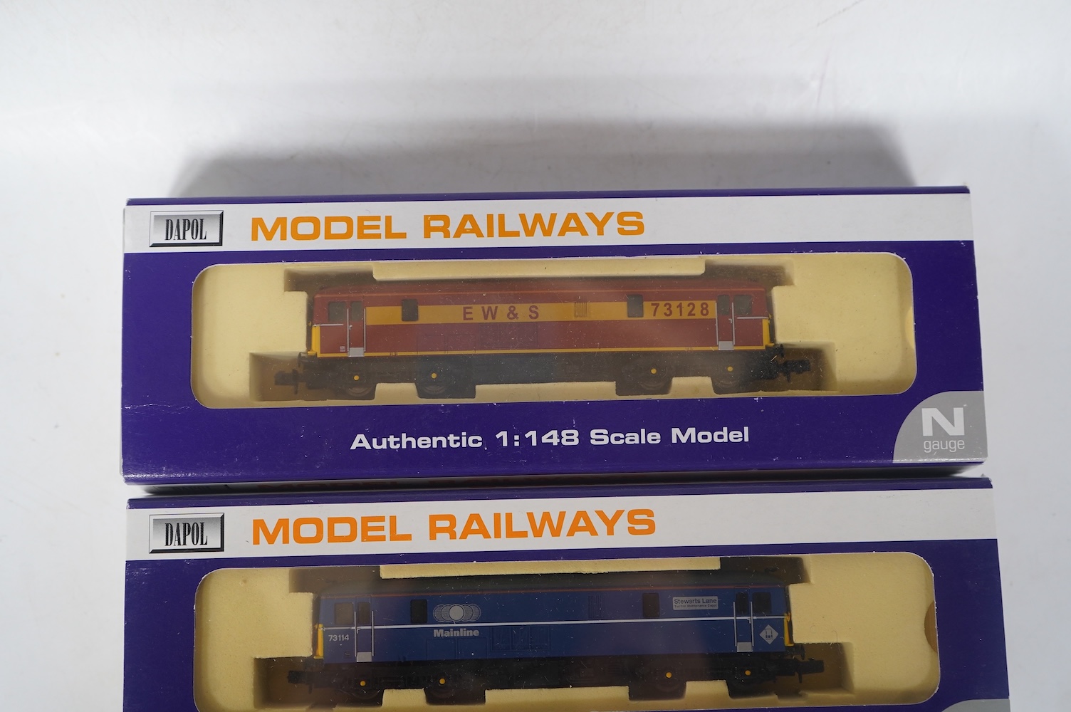 Three boxed Dapol N gauge railway Class 73 electro-diesel locomotives; 73109 Battle of Britain (ND006), 73114 Stewarts Lane (ND-021a) and 73128 (ND005). Condition - good.
